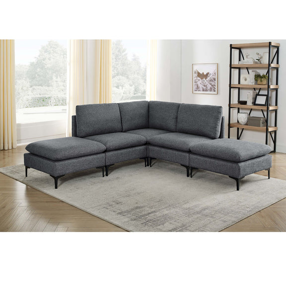 Dark gray upholstered modular sectional with tall legs and chaise ottoman, corner layout