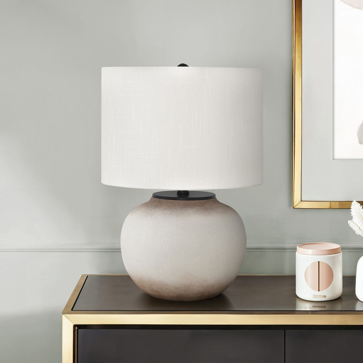 Cream ceramic table lamp with white drum shade and spherical base
