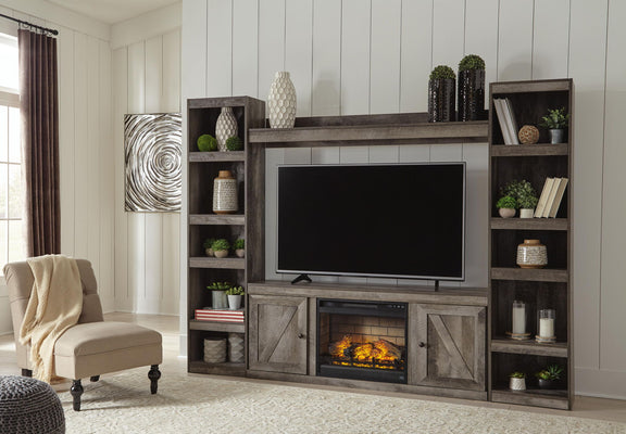 Gray entertainment center with wide TV opening, shelving, and built-in faux fireplace