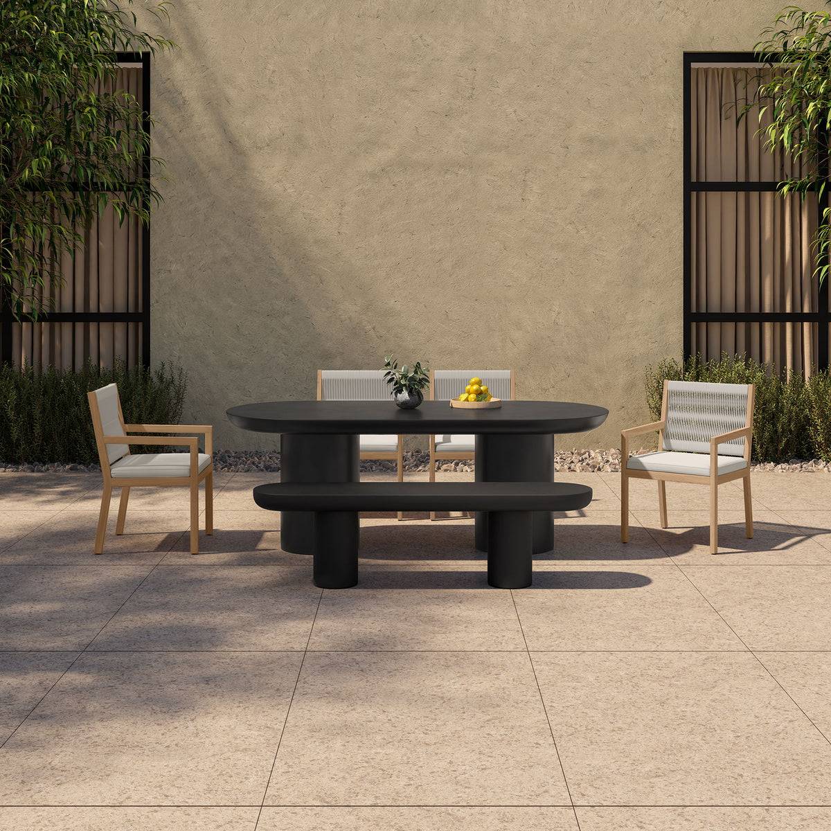 Black round outdoor cement dining table with stacked pedestal base