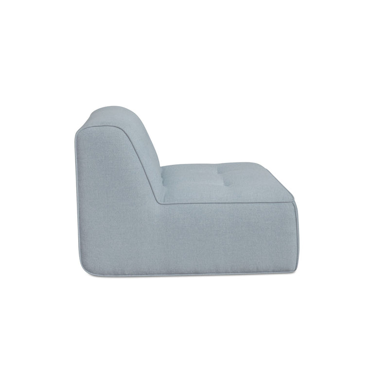 Light blue outdoor slipper chair with curved back and thick padded seat, side view