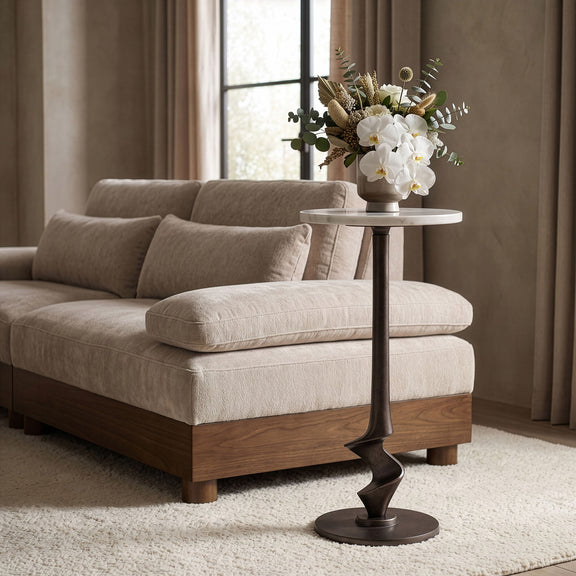 Aluminum side table with dark twisted pedestal base and round tabletop