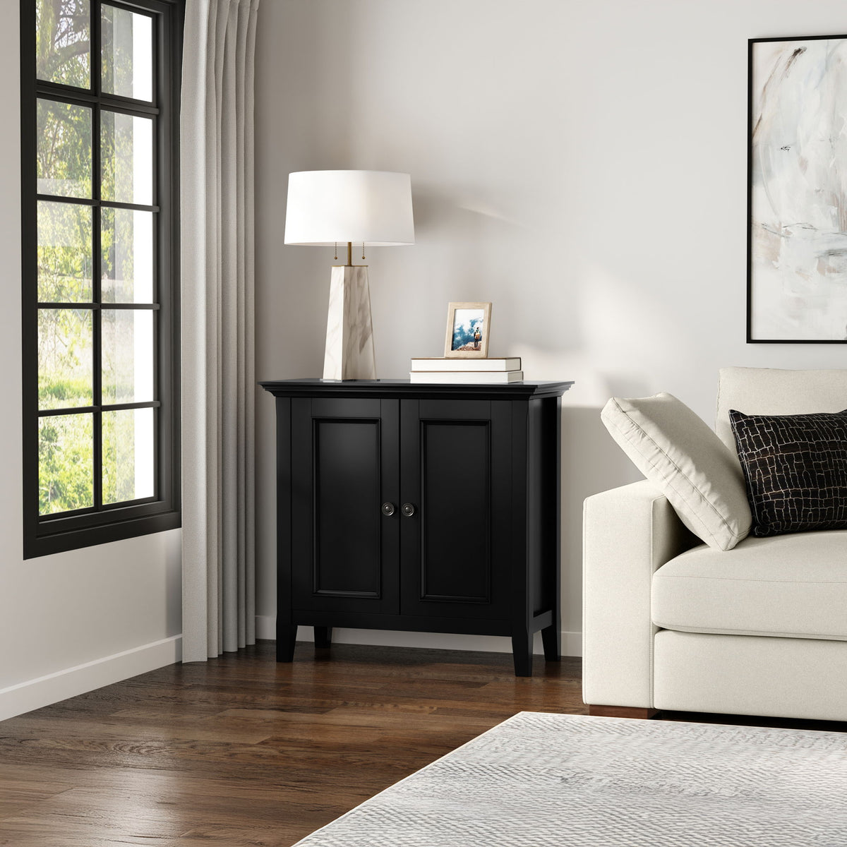 Black low storage cabinet with two doors and open interior shelves