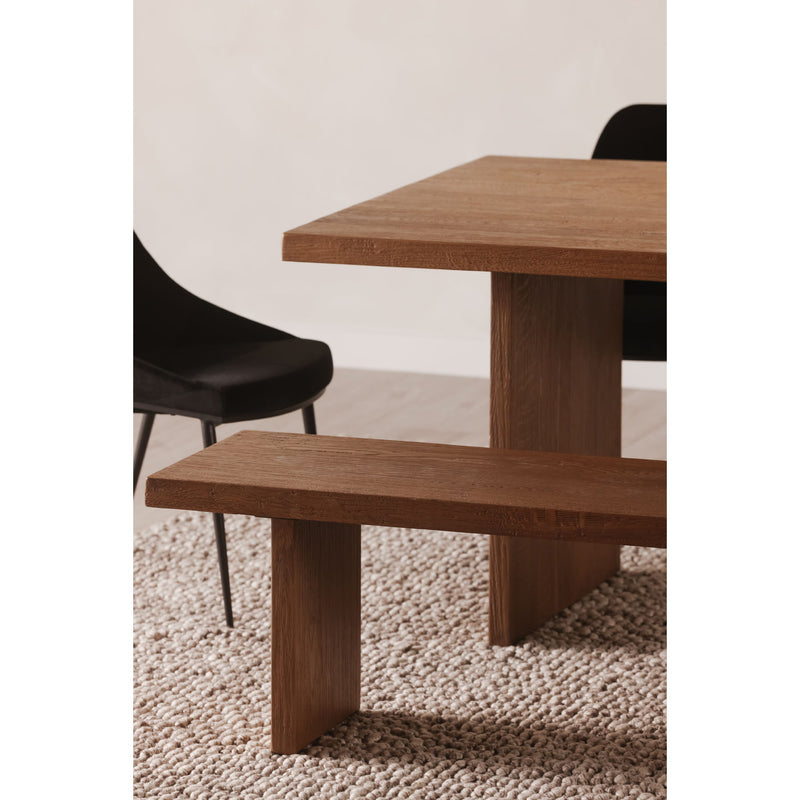 Amber oak dining table with thick tabletop and lower shelf framed by posts