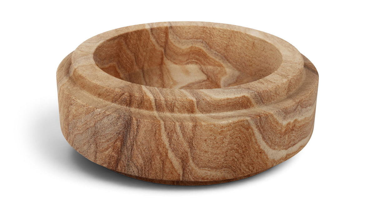 Light brown sandstone bowl with varied swirls and smooth rounded rim.