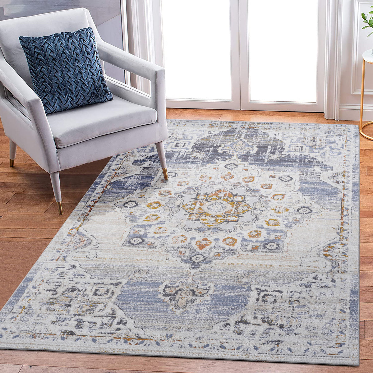 Payas medallion area rug, light cream with blue and small orange accents, centered motif