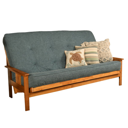 Queen-size futon frame sofa with dark blue fabric, tufted back, and throw pillows