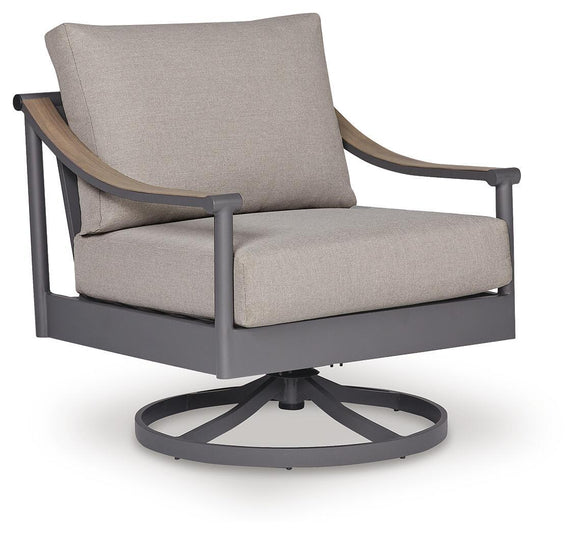 Gray swivel lounge chair with beige cushion and curved arms, dark gray legs and circular base