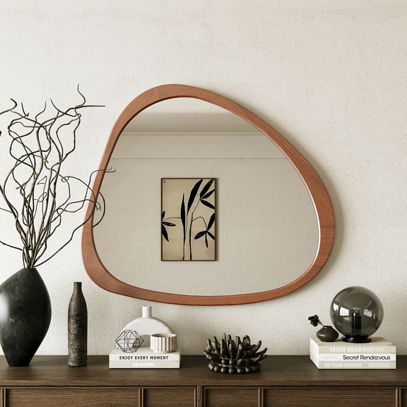 Asymmetrical teardrop wall mirror with natural wood frame and wide glass surface