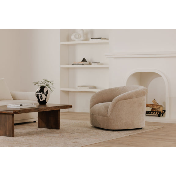 Beige upholstered lounge chair with rounded arms and back, low barrel shape.