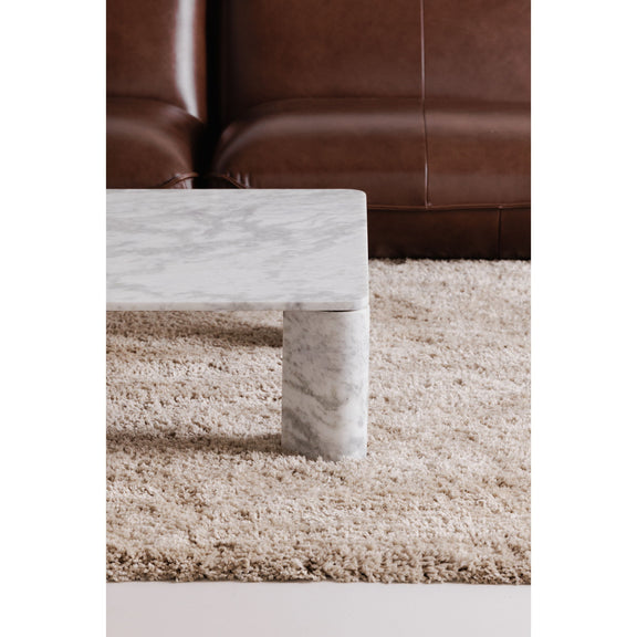 Gray marble-effect coffee table corner view with rounded block legs