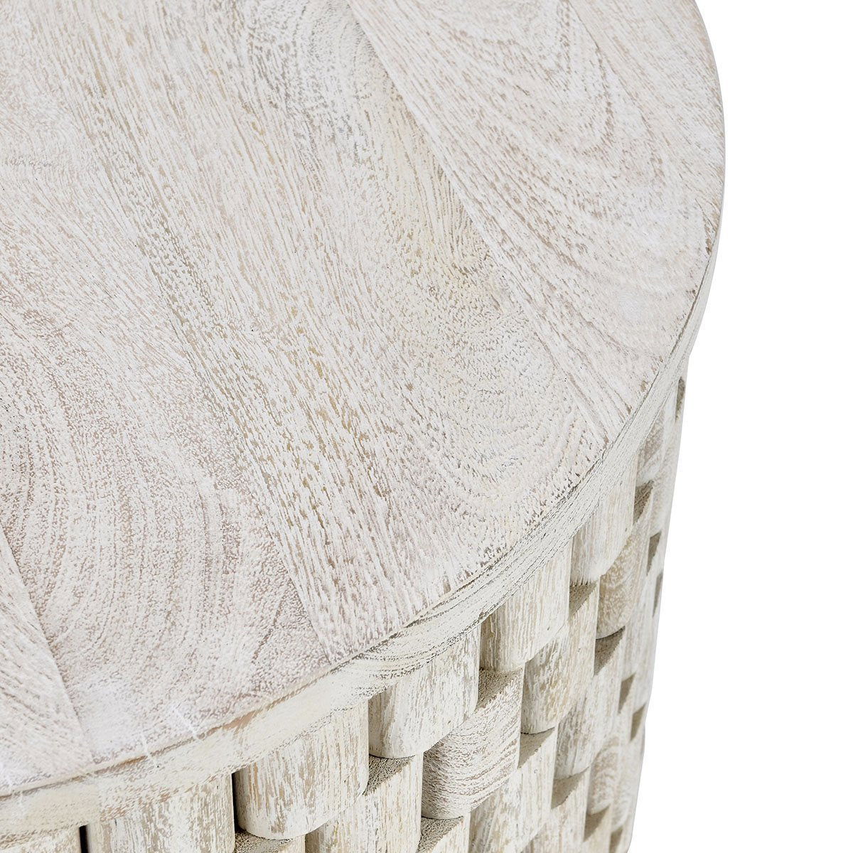Close-up of cream round tabletop with textured, lightly distressed finish