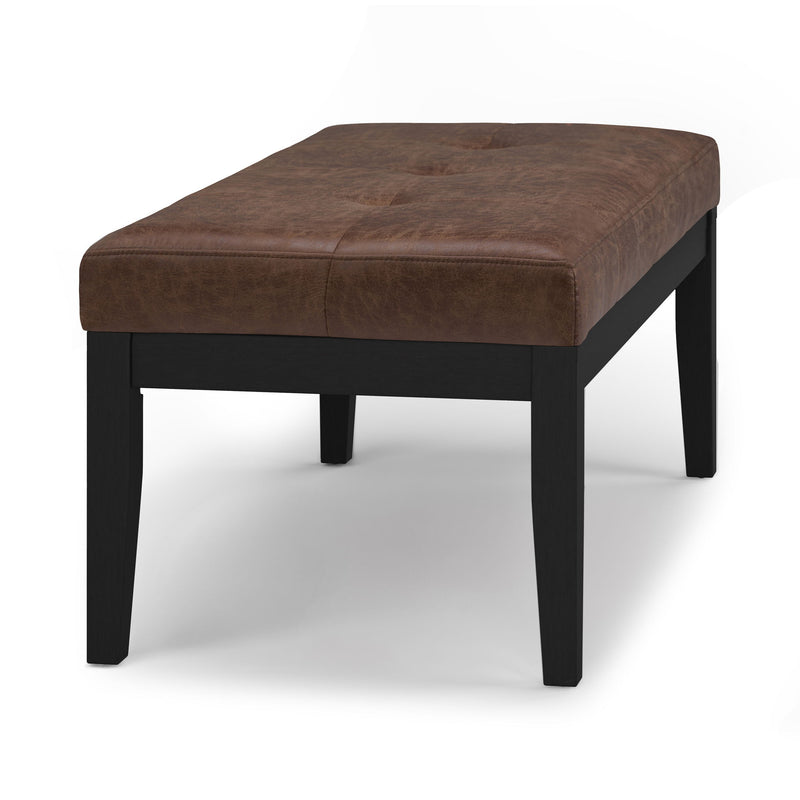 Tufted ottoman bench in dark brown upholstery with square black legs
