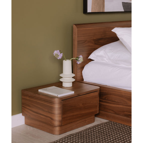 Queen bed with natural walnut panel headboard and matching nightstand, white bedding