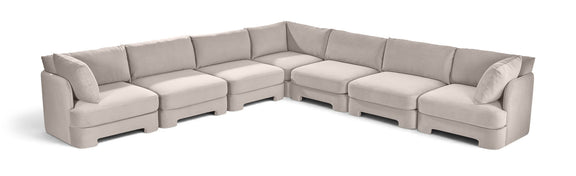 Light gray velvet corner sectional sofa with 7-piece modular arrangement
