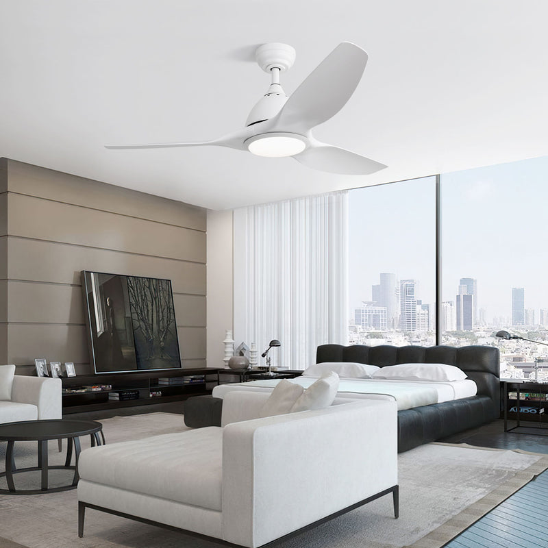 White ceiling fan with three blades and frosted light fixture in a living room