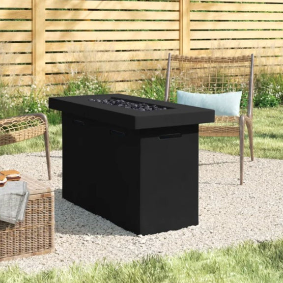 Dark outdoor propane fire pit table with black burner pan, stone bed, and side handles