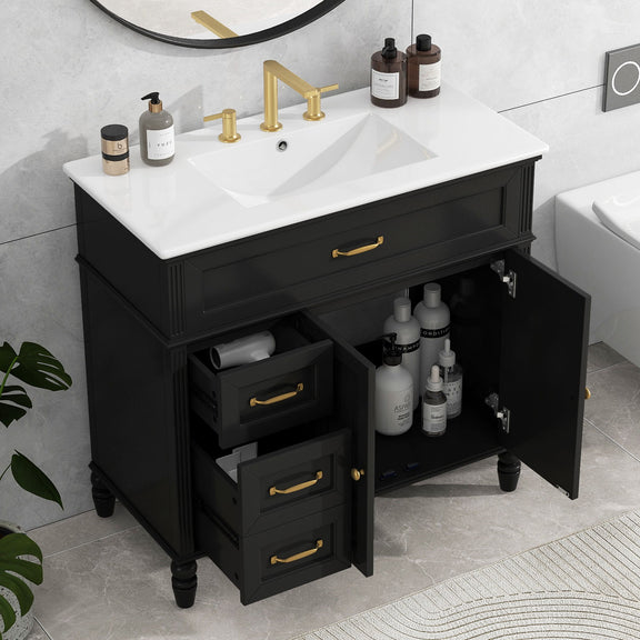 Black bathroom vanity with white sink top, open drawers and shelves, gold hardware