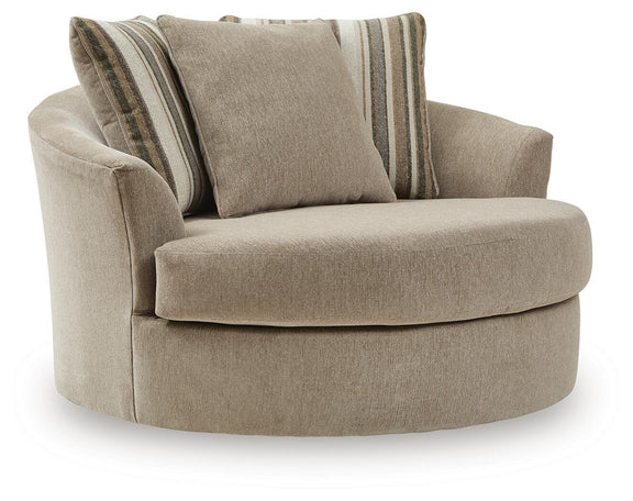 Oversized swivel accent chair in light beige fabric with two striped accent pillows