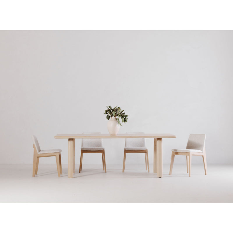 White oak dining table with slim apron and four straight legs