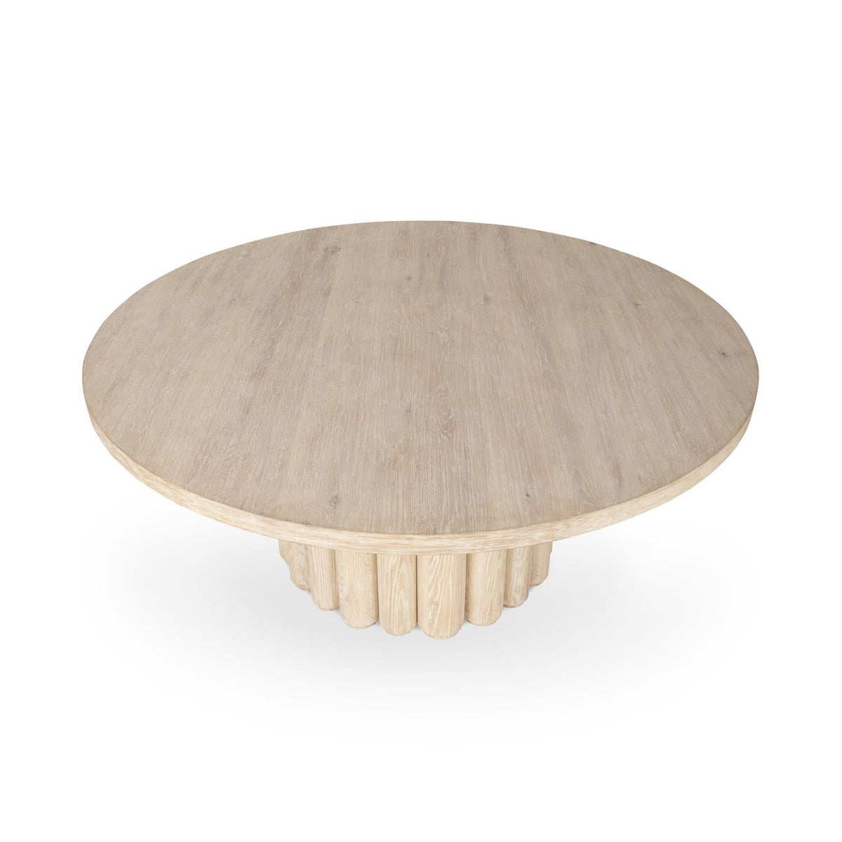 Cream washed round dining table with scalloped pedestal base and light wood grain.