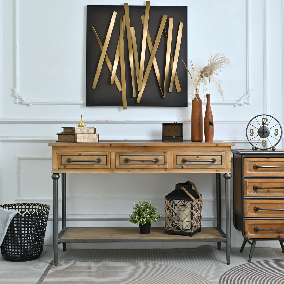 Wood console table showing three drawers and open shelf with turned dark legs
