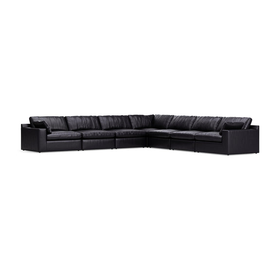 Emilia sectional sofa in black with padded armrests and segmented cushions