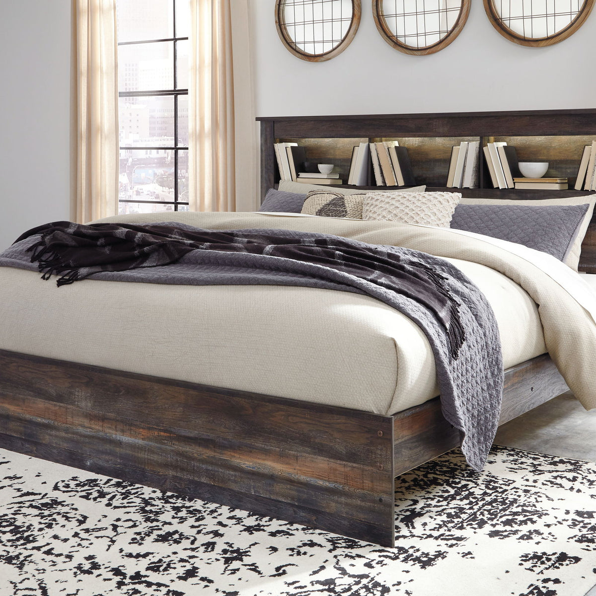 Panel bookcase bed with dark wood finish, open headboard shelving, and visible side drawers