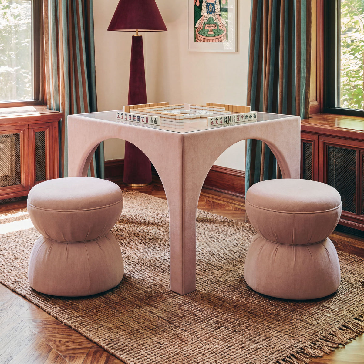 Light brown ruched upholstered ottoman with rounded top and stacked cushioned base