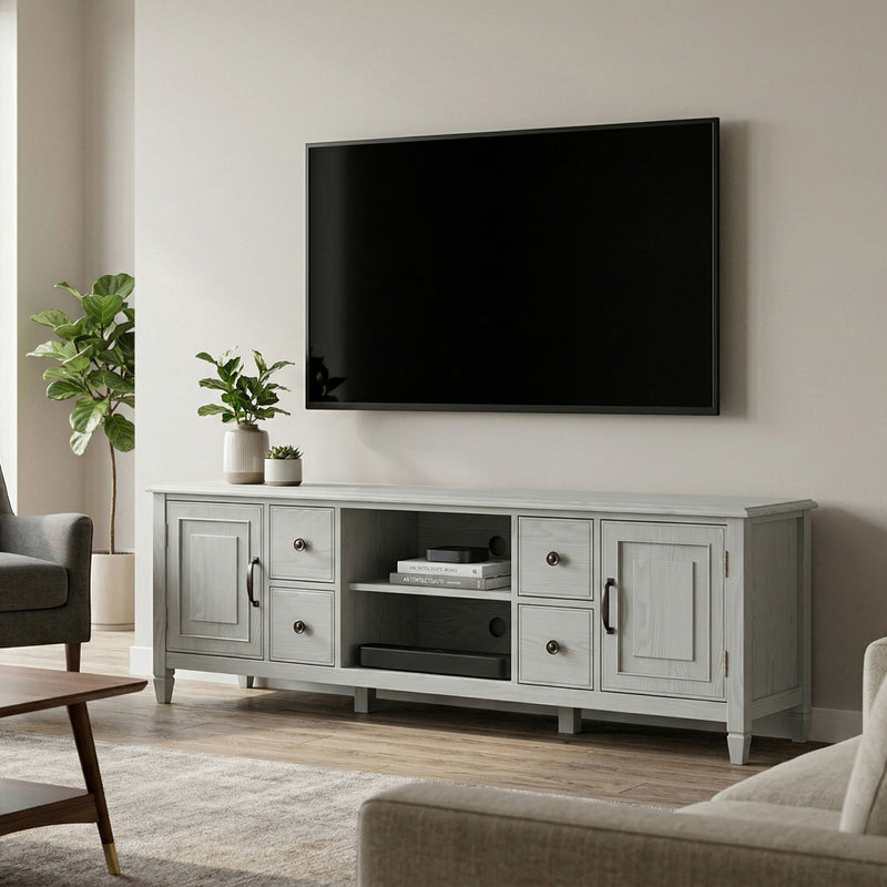 White wide TV stand with cabinet doors and central open media compartment