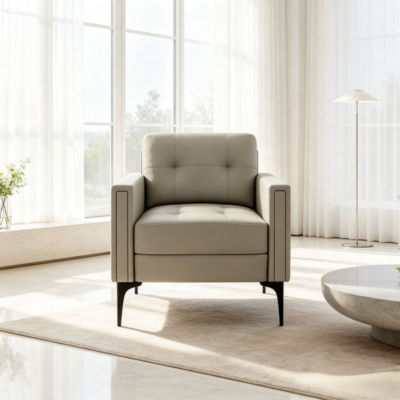 Beige upholstered armchair with wide arms and tufted back