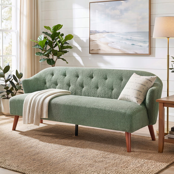 Green tufted upholstered 3-seater couch with curved arms and tapered wood legs