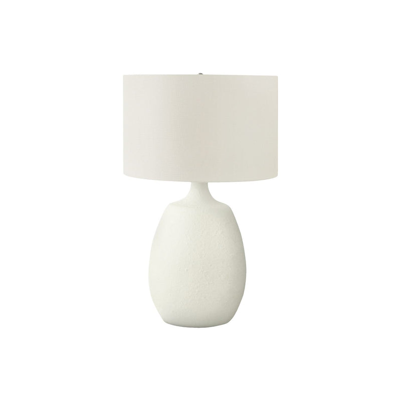 Cream resin table lamp with fabric drum shade and rounded textured base