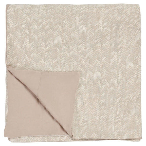 Natural French herringbone duvet, folded with layered overlap and light beige reverse