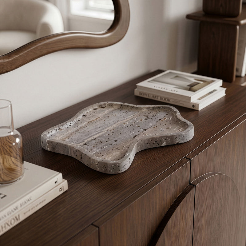 Gray speckled marble tray with organic shape and wavy rim for serving