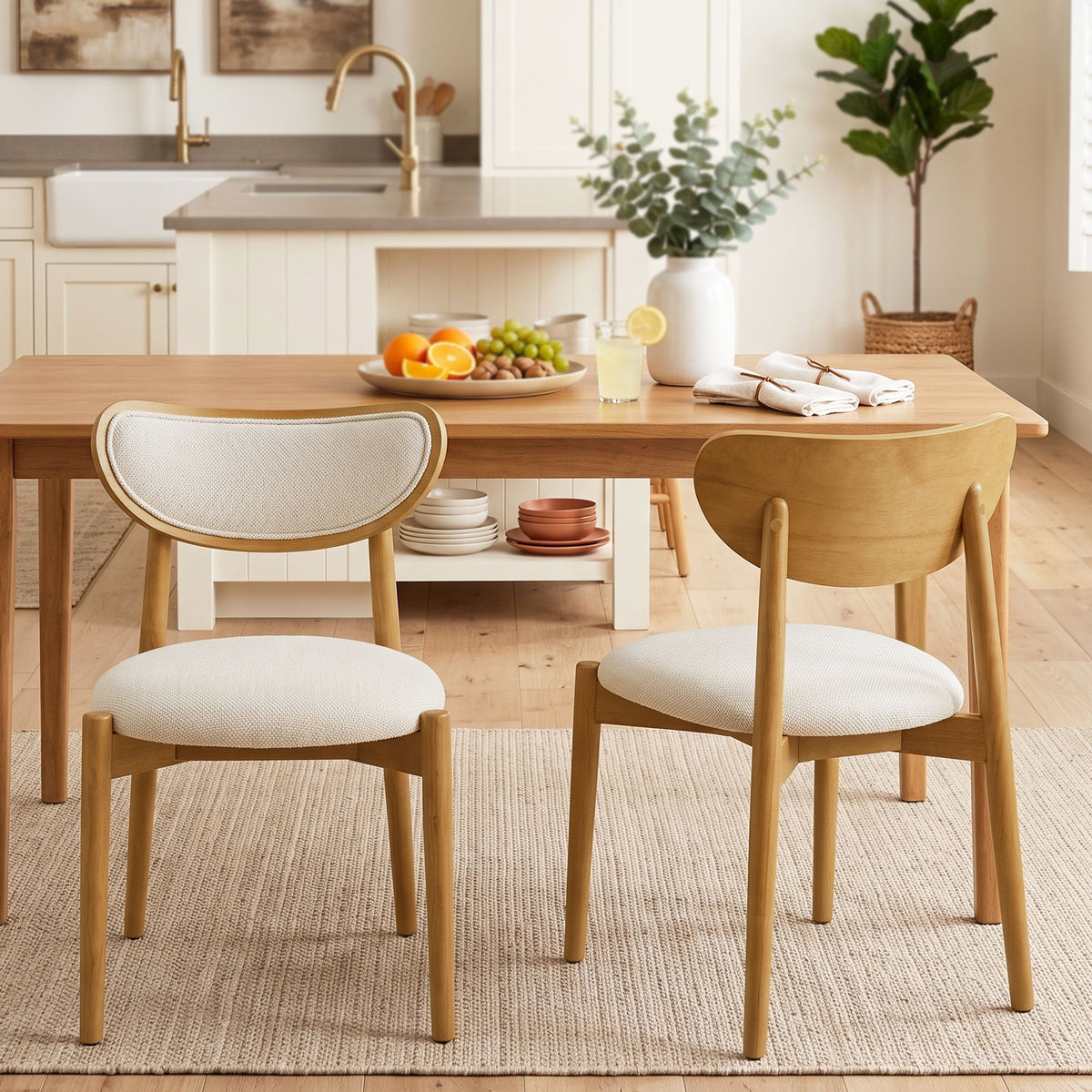 Beige upholstered dining chairs with curved backs, shown from front and back