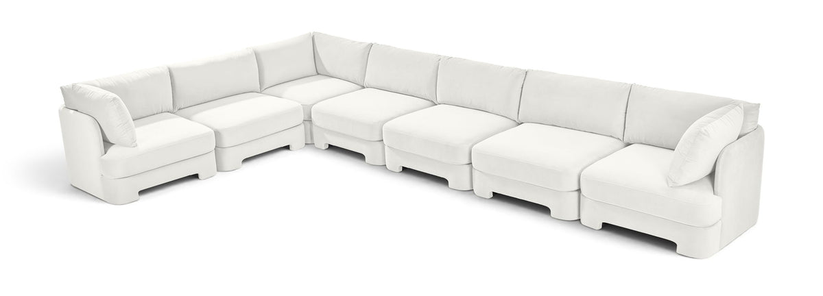 Velvet sectional sofa in white with square arms and tufted-looking seat cushions
