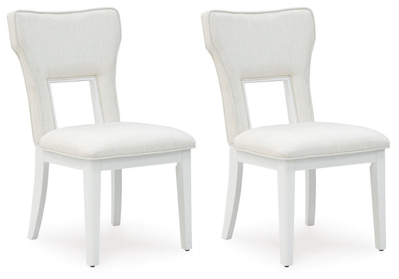 Pair of upholstered dining side chairs with white frames and light beige seat cushions
