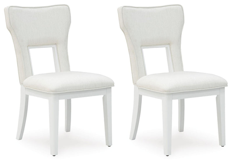 Pair of upholstered dining side chairs with white frames and light beige seat cushions