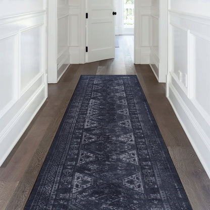Washable runner rug in dark blue-gray with textured distressed medallion design.