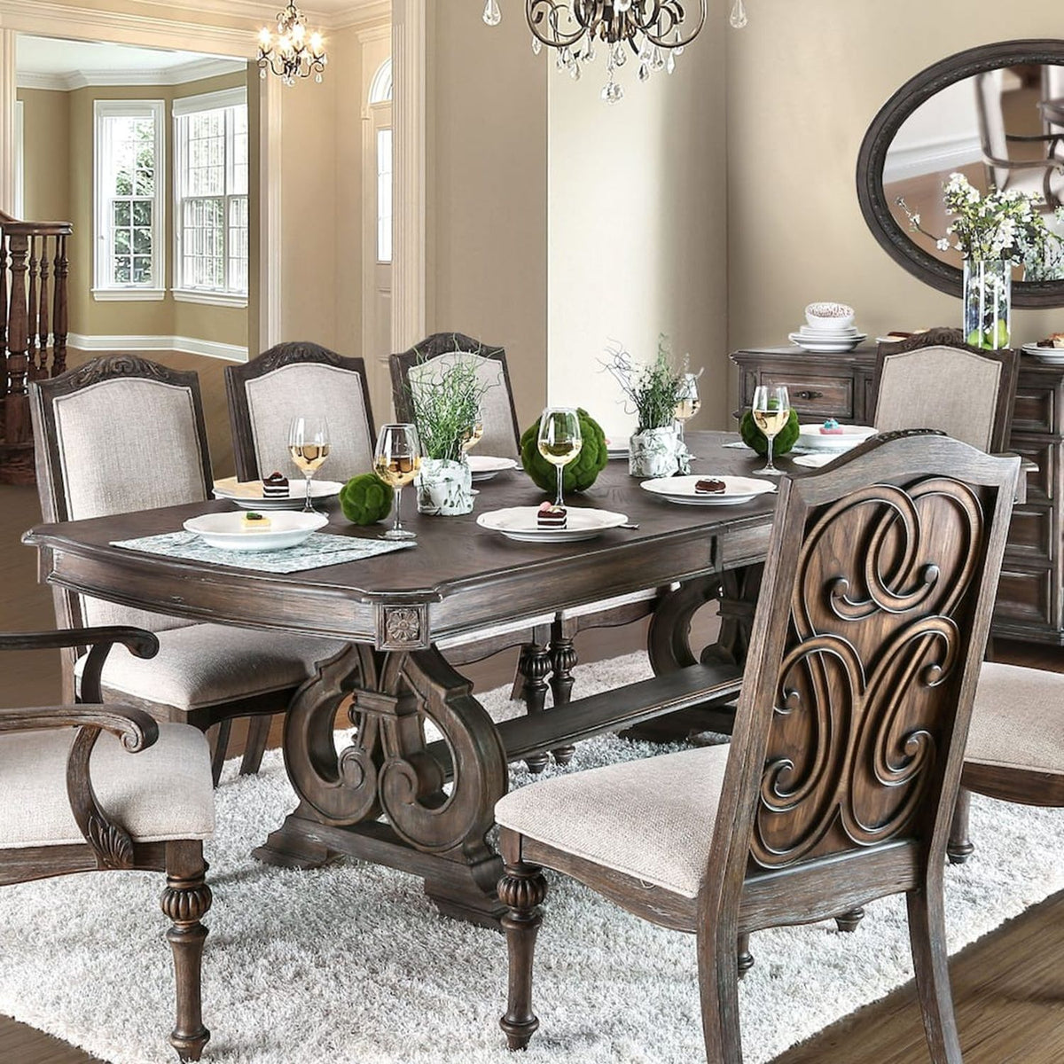 Rustic dining table with dark wood top and beige upholstered chairs