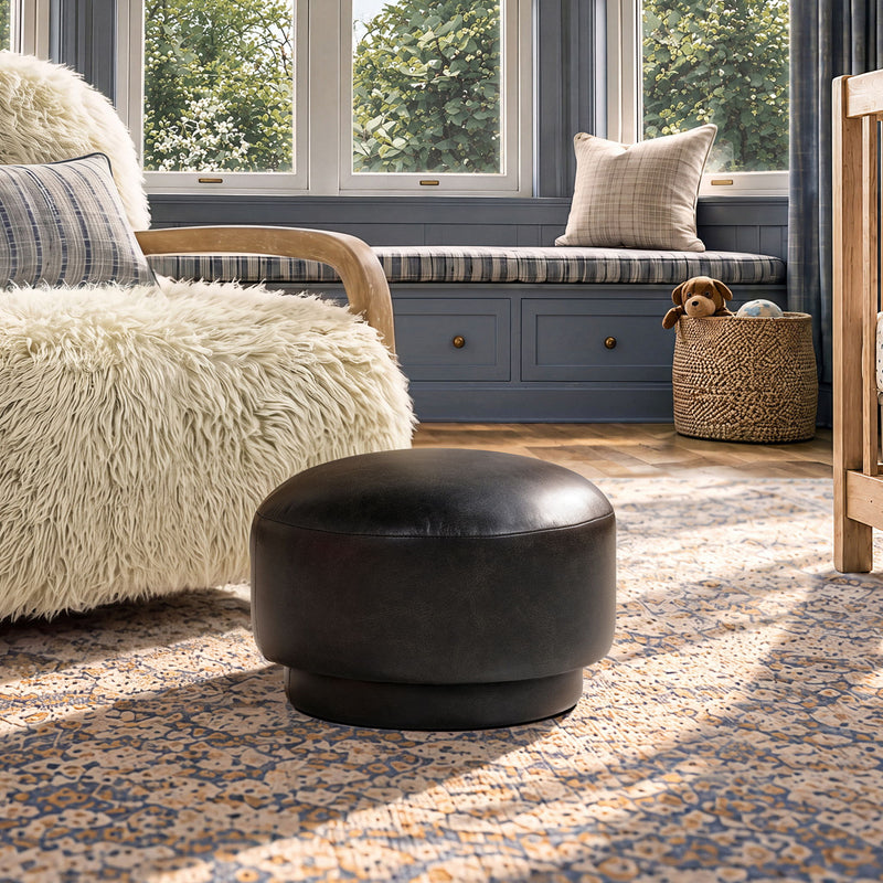 Black rounded mushroom ottoman footstool with smooth upholstered surface