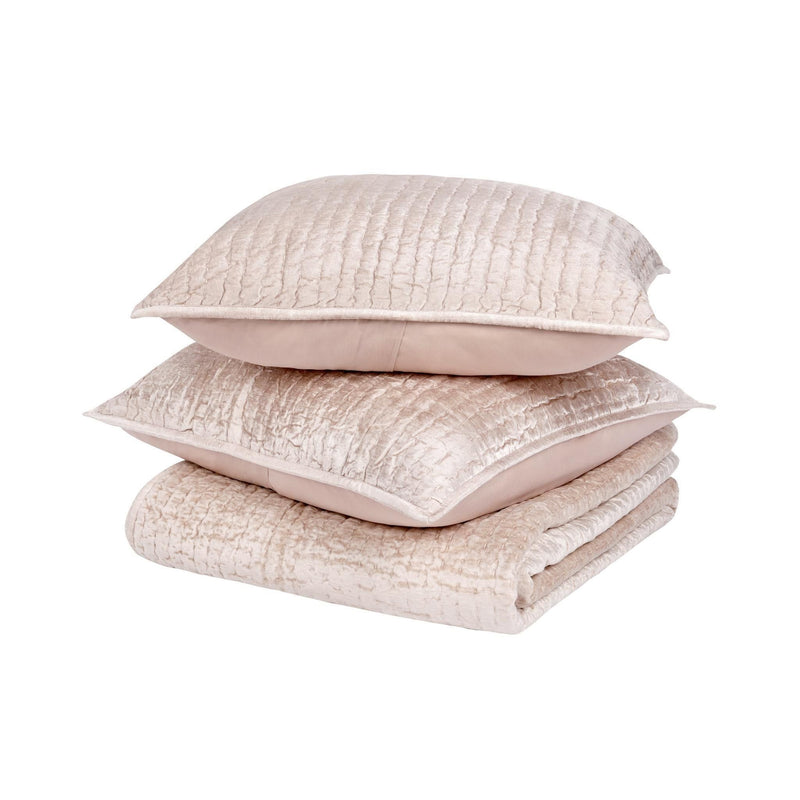Light beige velvet quilt set with coordinating shams and pillows