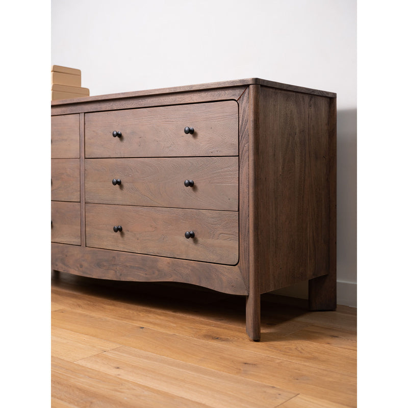 Dark brown 6-drawer dresser with black knobs and curved front edges on legs