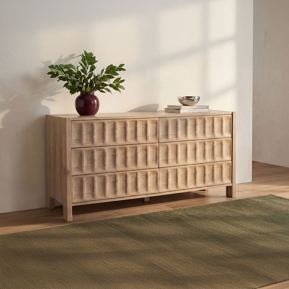 Natural wood dresser with stacked drawer fronts and tapered legs