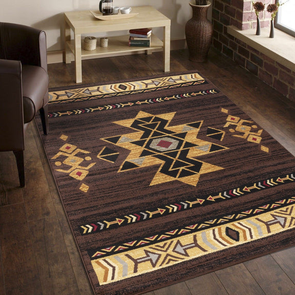 Southwest area rug, dark brown with large gold star medallion and cream patterned border