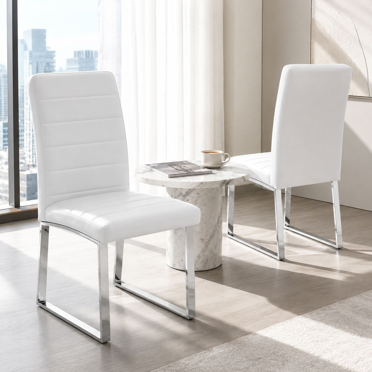 White oversized dining chair with padded seat, tall backrest, and metal legs