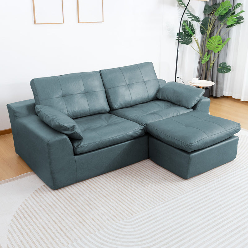 Blue L-shaped sofa with movable ottoman; cushioned backrests and padded seat cushions
