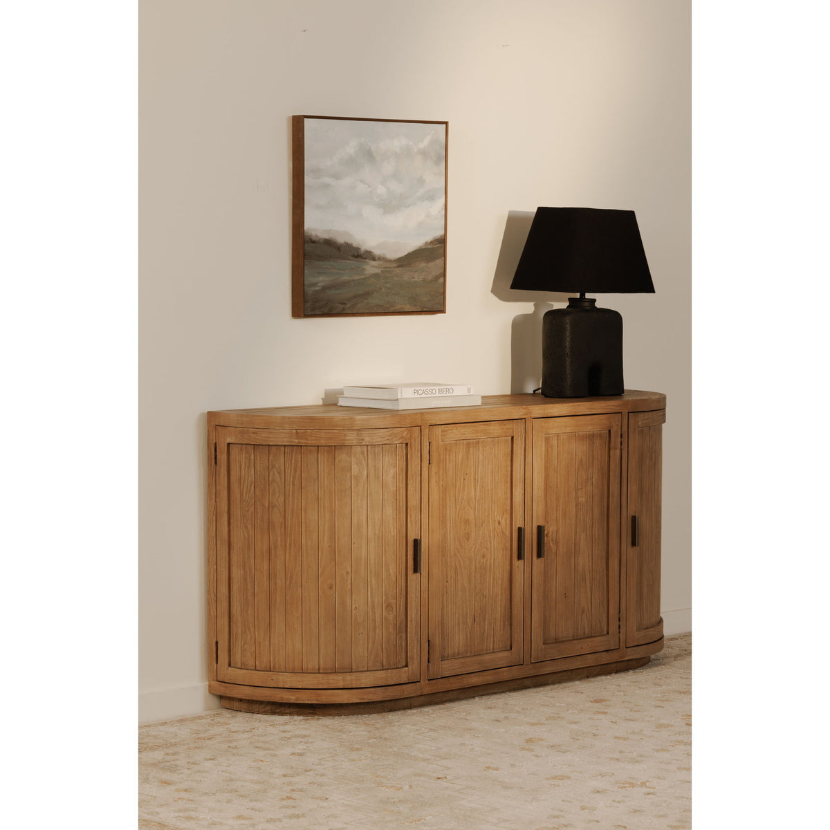 Natural wood sideboard with rounded corners, four doors, and metal pulls