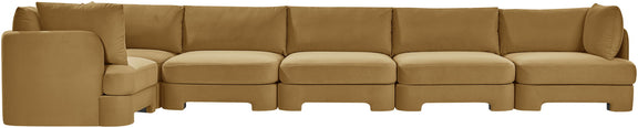 Light brown velvet L-shaped sectional sofa with tufted back and padded chaise seating.